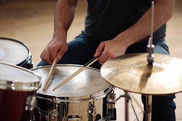 Can Drumming Workshops Serve as Effective Group Therapy for Stress Reduction?
